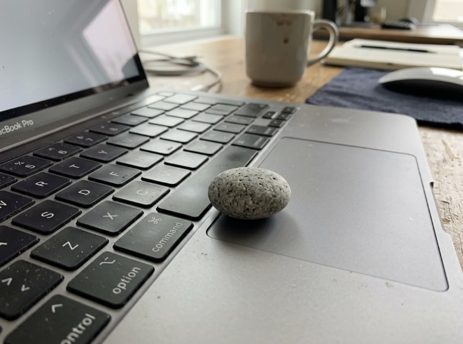 Smart Rock resting on a laptop trackpad